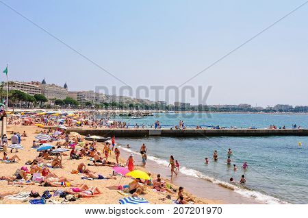 Vacationers enjoy the beautiful weather on the public beach - Cannes, France, 9 July 2013