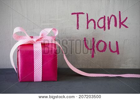 Gray Grungy Vintage Cement Wall With English Text Thank You. Pink Gift Or Present With Bow.