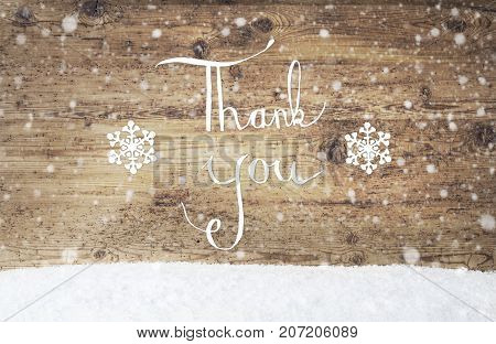 English Calligraphy Thank You. Rustic Wooden Background With Snow And Snowflakes