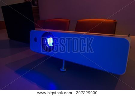 blurred -projector connected to Laptop for presentation in a meeting room