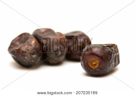Fresh sweet dates on white background, close up