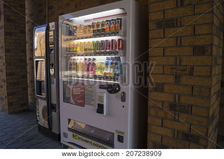 a vending machine selling drinks in the shopping center 