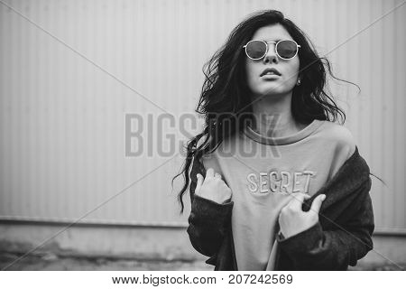 Portrait Of Stylish Modern Young Curly Woman In Coat Sunglasses