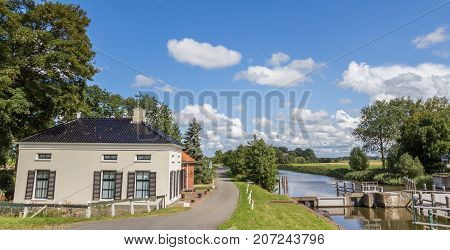 Panorama of an old house at the river in Groningen Netherlands