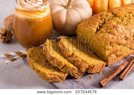 Pumpkin bread cake with pumpkin spice latte for autumn fall dinner