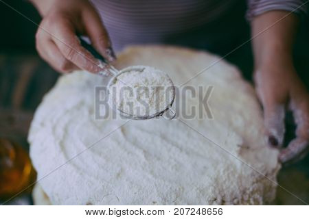 Close Up View Of Baker Kneading Dough. Homemade Bread. Hands Preparing Bread Dough On Wooden Table.