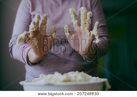 Close Up View Of Baker Kneading Dough. Homemade Bread. Hands Preparing Bread Dough On Wooden Table.