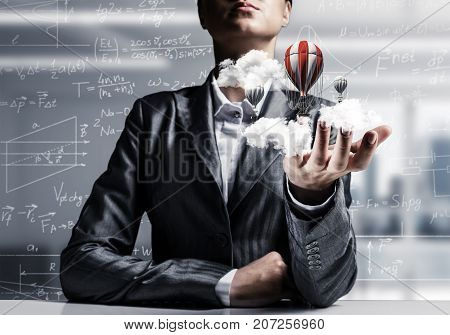 Closeup of business woman in suit presenting flying aerostate among clouds in her palm with business sketches on background. 3D rendering.
