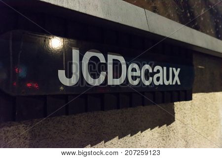 Northampton UK October 3, 2017: JCDecaux logo sign under advertising stand in town centre.