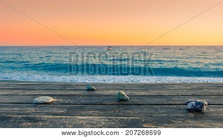 Summer view of a beach at sunset with stones on a table, Tertsa, Crete, Greece