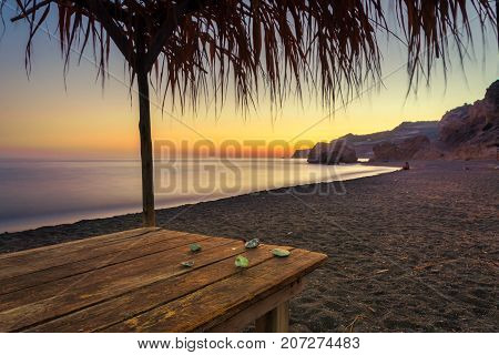 Summer view of a beach at sunset with stones on a table, Tertsa, Crete, Greece
