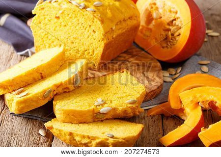 Fresh Baked Pumpkin Bread On Wooden Board With Seeds. Horizontal
