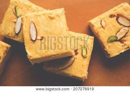 Stock photo of Soan Papdi or Soan roll or Patisa or patisha, popular sweet from India. selective focus