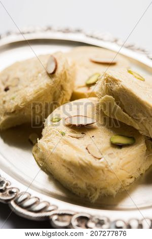 Stock photo of Soan Papdi or Soan roll or Patisa or patisha, popular sweet from India. selective focus