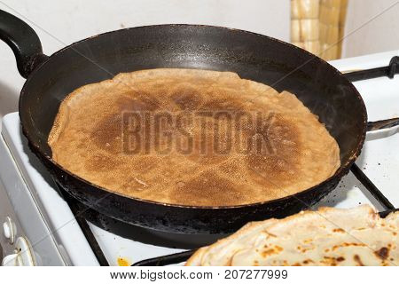 pancakes fried in a pan . Photos in the studio