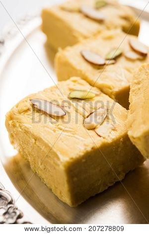 Stock photo of Soan Papdi or Soan roll or Patisa or patisha, popular sweet from India. selective focus