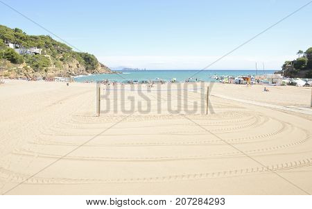 BEGUR, SPAIN - JULY 25, 2017: Summer day at the beach of Sa Riera a fishing village and holiday resort situated in the Costa Brava Girona Catalonia Spain.