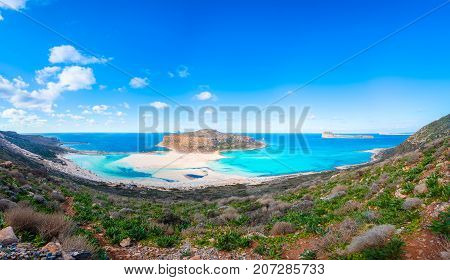 Amazing view of Balos Lagoon with magical turquoise waters, lagoons, tropical beaches of pure white sand and Gramvousa island on Crete, Greece