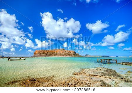 Amazing view of Balos Lagoon with magical turquoise waters, lagoons, tropical beaches of pure white sand and Gramvousa island on Crete, Greece