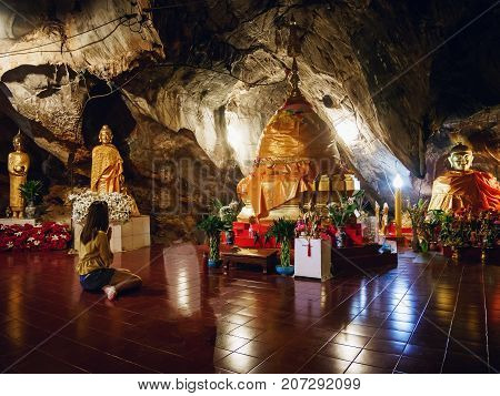 CHIANG RAI THAILAND - JULY 29 2017: Interior of Tham pha jom golden temple in the cave on July 29 2017 in Chiang rai Thailand.