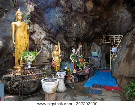 CHIANG RAI THAILAND - JULY 29 2017: Interior of Tham pha jom golden temple in the cave on July 29 2017 in Chiang rai Thailand.