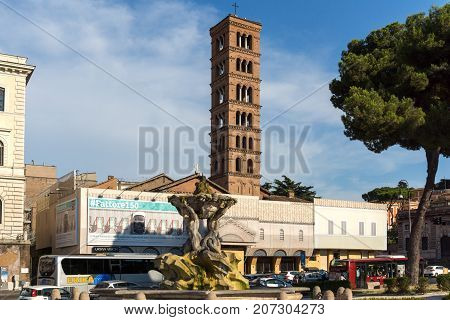 ROME, ITALY - JUNE 22, 2017:  Amazing view of Church of Santa Maria in Cosmedin and Fountain of the Tritons in city of Rome, Italy