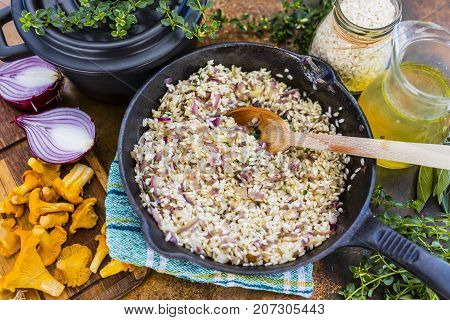 Risotto with chanterelle mushrooms and herbs. Italian food.