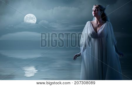Young elven girl at sea shore