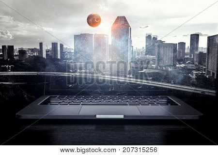 Laptop and construction concept. Mixed media