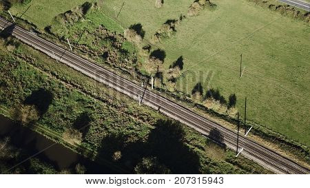 Aerial photo over railway track train line in rural countyside