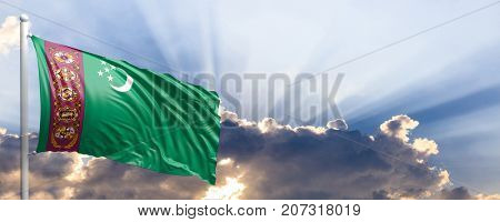 Turkmenistan waving flag on blue sky. 3d illustration