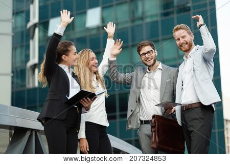 Successful usiness people and coworkers meeting outside