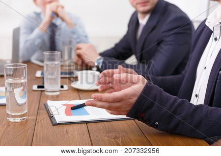 Business meeting. Closeup hands of young people working at desk