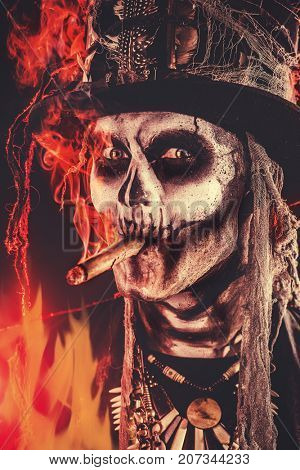 Baron Saturday. Baron Samedi. A man with a skull makeup dressed in a tail-coat and a top-hat. Dia de los muertos. Day of The Dead. Halloween.