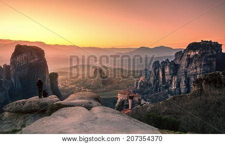 Breathtaking view of Meteora at sunset, Greece. Geological formations of big rocks with Monasteries  on top of them.