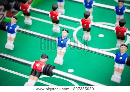 table football table football .sports teams players in red and blue uniform.