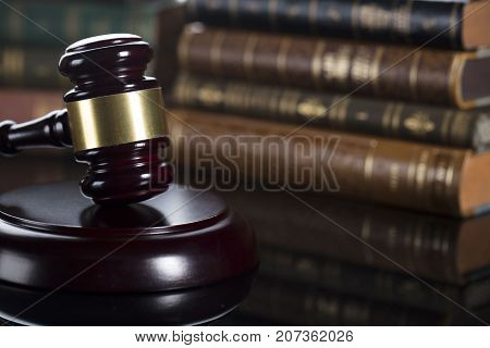 Auction sale and business concept.  Gavel and commercial code on the wooden background.