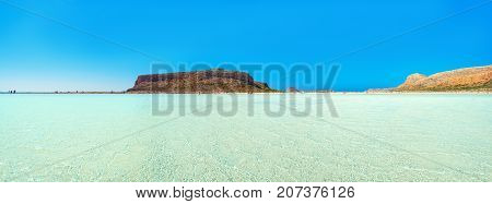 Amazing view of Balos Lagoon with magical turquoise waters, lagoons, tropical beaches of pure white sand and Gramvousa island on Crete, Greece