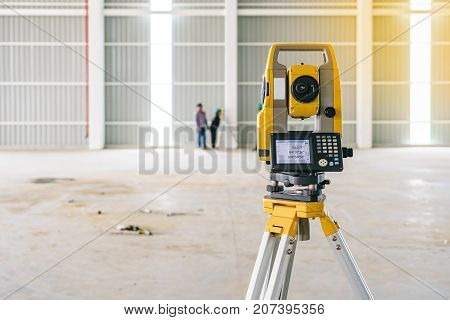 Surveyor equipment tacheometer or theodolite outdoors at construction site