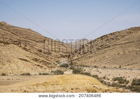 Road between the hills in the desert Negev leaving from the Colored Sands (Israel)