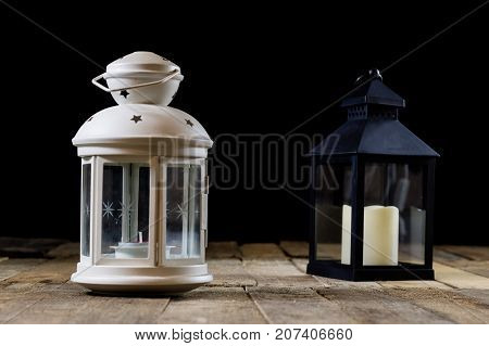 Two Small Lanterns On A Wooden Table. Candle In Old Latarence. Wooden Table.