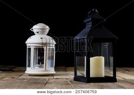 Two Small Lanterns On A Wooden Table. Candle In Old Latarence. Wooden Table.