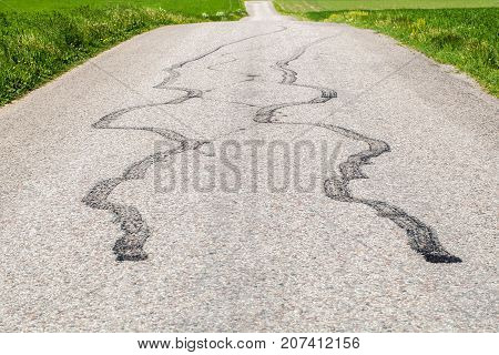 Tire marks on road after drift .