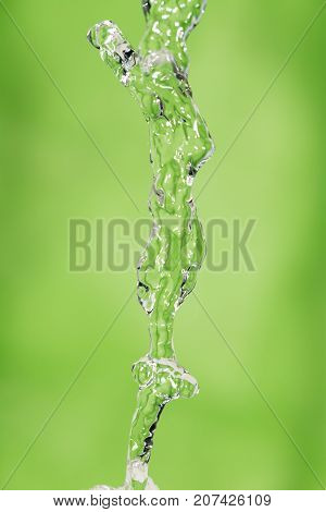 a jet of water on a green background