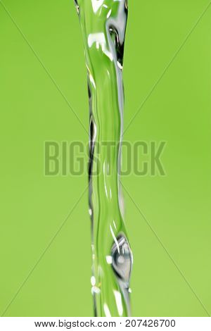 a jet of water on a green background