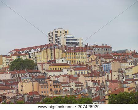 Cityscape view on top hill La Croix-Rousse ginger cross neighborhood of Lyon France with colorful houses and buildings