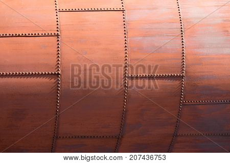 The skin of an old rusty blast furnace at an old factory.