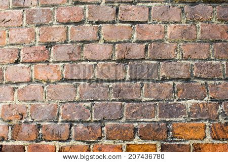 Brick masonry walls of an old chimney at an ancient factory.