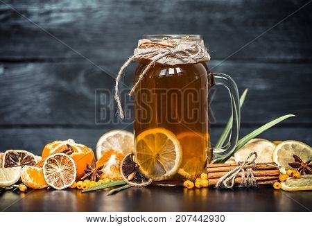 The Composition Of Tea With Lemon On A Black Background
