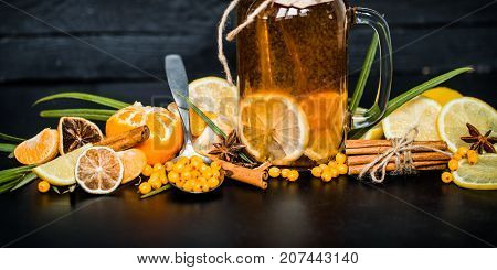 The Composition Of Tea With Lemon On A Black Background